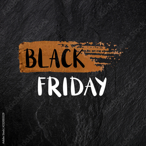 Black Friday banner with hand drawn lettering with a golden bronze brush stroke texture on a black background, with copy space