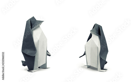 Two paper penguins isolated on white, clipping path included