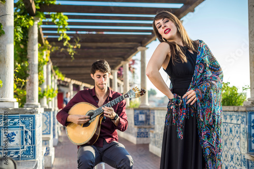 Band performing traditional music fado under pergola with azulejos in Lisbon, Portugal