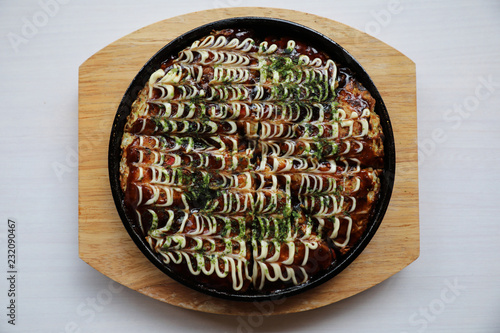 Japanese food okonomiyaki , Japanese pizza on wood plate