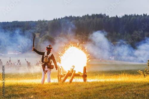 Gun Shot With Flame. Historical reconstruction of the war of 1812. The battle near Smolensk. Russia