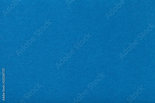 Light blue matt suede fabric closeup. Velvet texture of felt.
