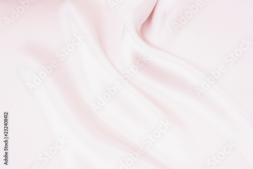 Tekstura satynowej tkaniny w kolorze różowym na tle
