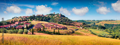 Colorful spring view of Pienza town. Picturesque morning panorama of Tuscany, San Quirico d'Orcia, Italy, Europe. Beauty of countryside concept background.