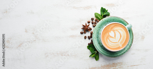 Cappuccino. Coffee with milk. On a white wooden background. Top view. Free copy space.