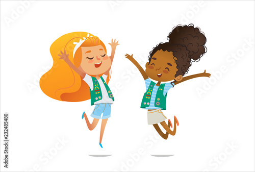 Young smiling girls scout dressed in uniform with badges and patches happily jump isolated on white background. Female scouter, member of troop, speaker.