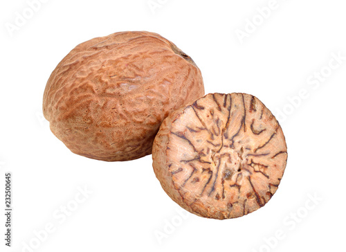 Nutmeg, fragrant nutmeg or true nutmeg. Whole nut and half. Isolated on white background