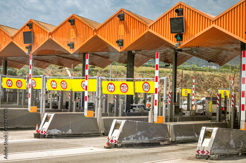 checkpoint on the entrance to a toll road with traffic gates