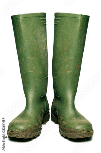 Wellington boots covered in mud, cut out