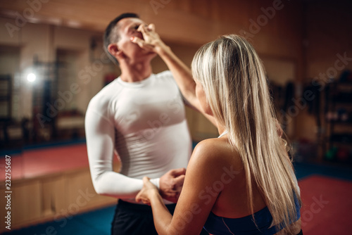 Female person makes pain in the eyes, self-defense