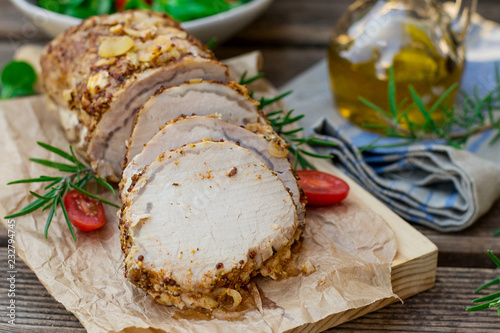 Roast pork loin in mustard marinade with rosemary