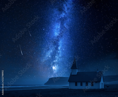 Milky way over small church on the beach, Iceland