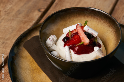 Estonian sweet dessert Kama with yoghurt mousse, wild berries an