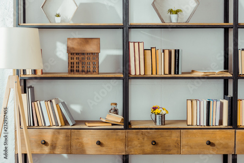 close up of wooden rack with books in living room