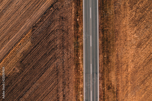 Aerial view of empty road through countryside