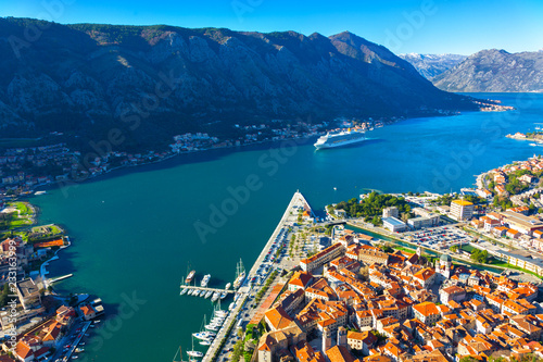 View from the height of the Bay of Kotor and a large tourist ship. Montenegro