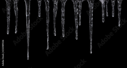 Close up of icicles isolated on black background