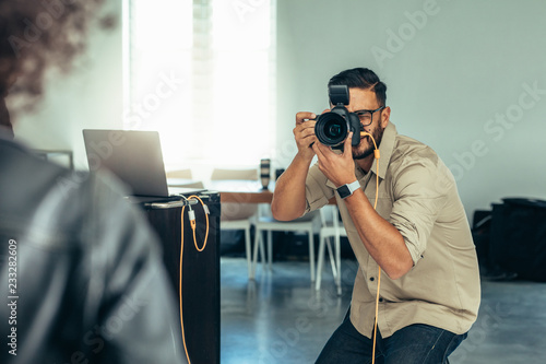 Photographer taking photo of a model