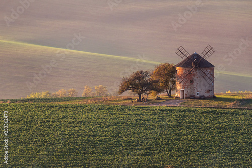Landscape with waves hills, autumn fields with mill. South Moravia