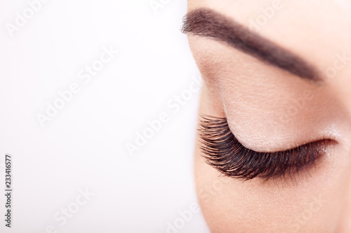 Female Eye with Extreme Long False Eyelashes. Eyelash Extensions. Makeup, Cosmetics, Beauty. Close up, Macro