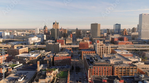 Milwaukee river in downtown, harbor districts of Milwaukee, Wisconsin, United States. Real estate, condos in downtown. Aerial view, drone flying