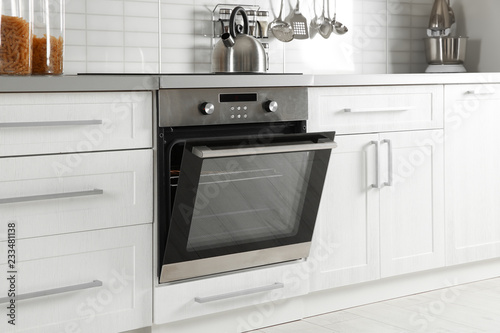 Open modern oven built in kitchen furniture