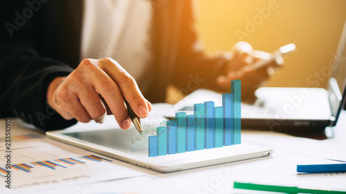 businessman investment consultant analyzing company financial report balance sheet statement working with digital graphs. Concept picture for stock market, office, tax,and project. 3D illustration.