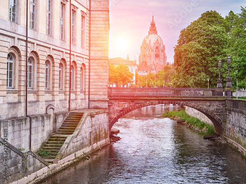 River Leine in Hanover city. City Hall background. View at sunset