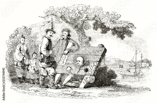 Old illustration of a man suffering the chinese pillory under the view of other people, outdoor. By unidentified author published on Magasin Pittoresque Paris 1839