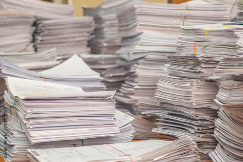 bundles bales of paper documents. stacks packs pile on the desk in the office