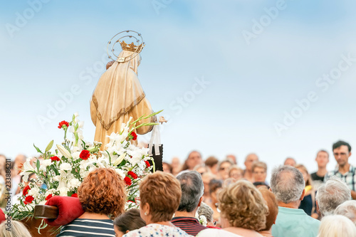 15 JULY 2018, TARRAGONA, SPAIN: People at celebration of religious holiday with Virgin Mary