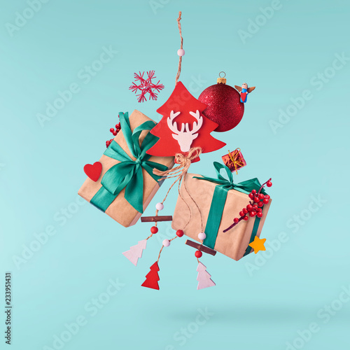 Christmas concept. Creative Christmas conception made by falling in air gift boxes, christmas decorations and toys