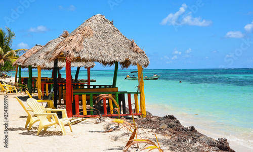 Chairs under umbrella in the caribean sea