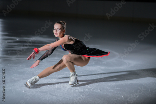 A young dancer during her performance. She is wearing a gorgeous costume.