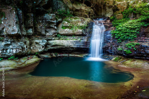 Waterfall into a rock pool deep in the wilderness