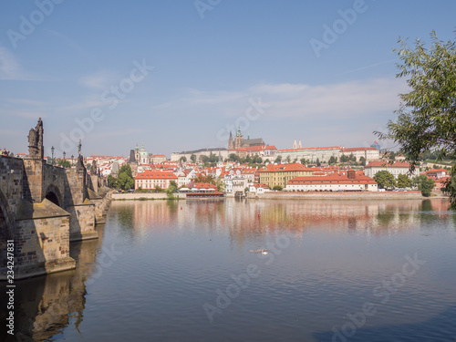 Panorama of Prague with a part of the Charles Bridge and the river. Czech capital.
