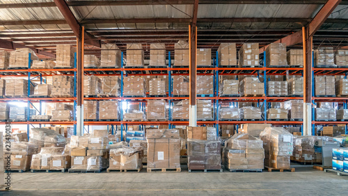 Shelf rack full of cartons at logistics warehouse