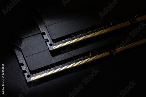 Close-up of Computer RAM (Random Access Memory) module on black background.