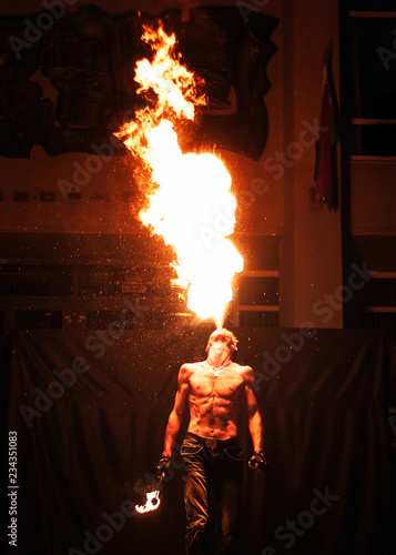 fire show, fire blowing performance, dancing with flame, male master fakir with fire works on street arts festival, fire breathing trick