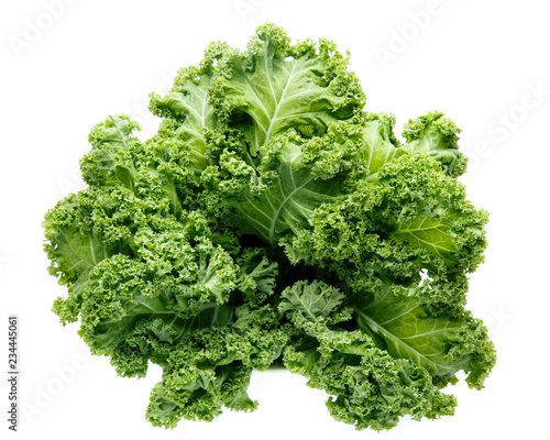 Fresh green organic kale leaves isolated on white.