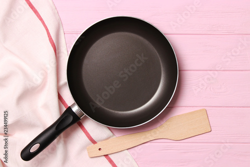 frying pan and on the wooden table top view. Cooking.