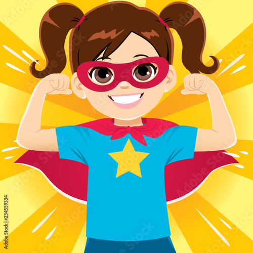 Happy funny and cute little super hero girl flexing arms showing strength