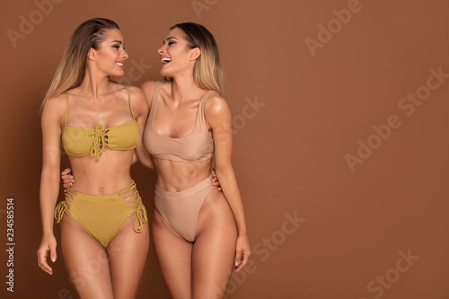 Beautiful sexy twins sisters having fun together