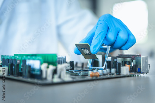 Close up portrait of computer engineer's hand is holding CPU's computer