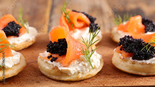 bread with cheese, salmon and caviar