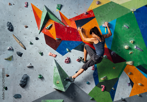 Woman on climbing wall