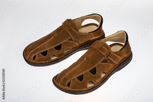 Summer man's sandals on a white background