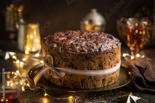 Traditional Christmas fruit cake on dark background