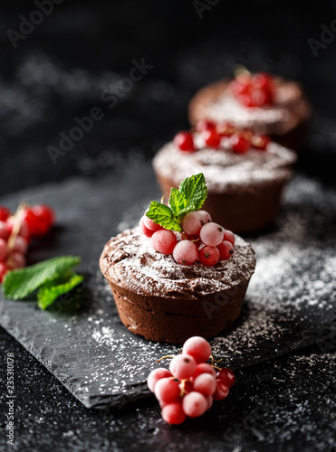 Classic chocolate fondant on a dark background. Chocolate muffins