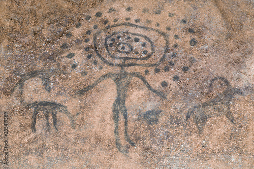 the image of an ancient man on the wall of the cave. history, archaeology.